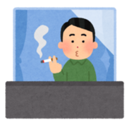 ベランダでたばこを吸う人